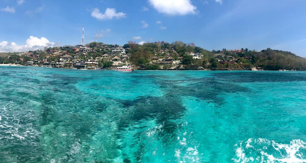 Aerial view of turquoise water reef and island in Bali