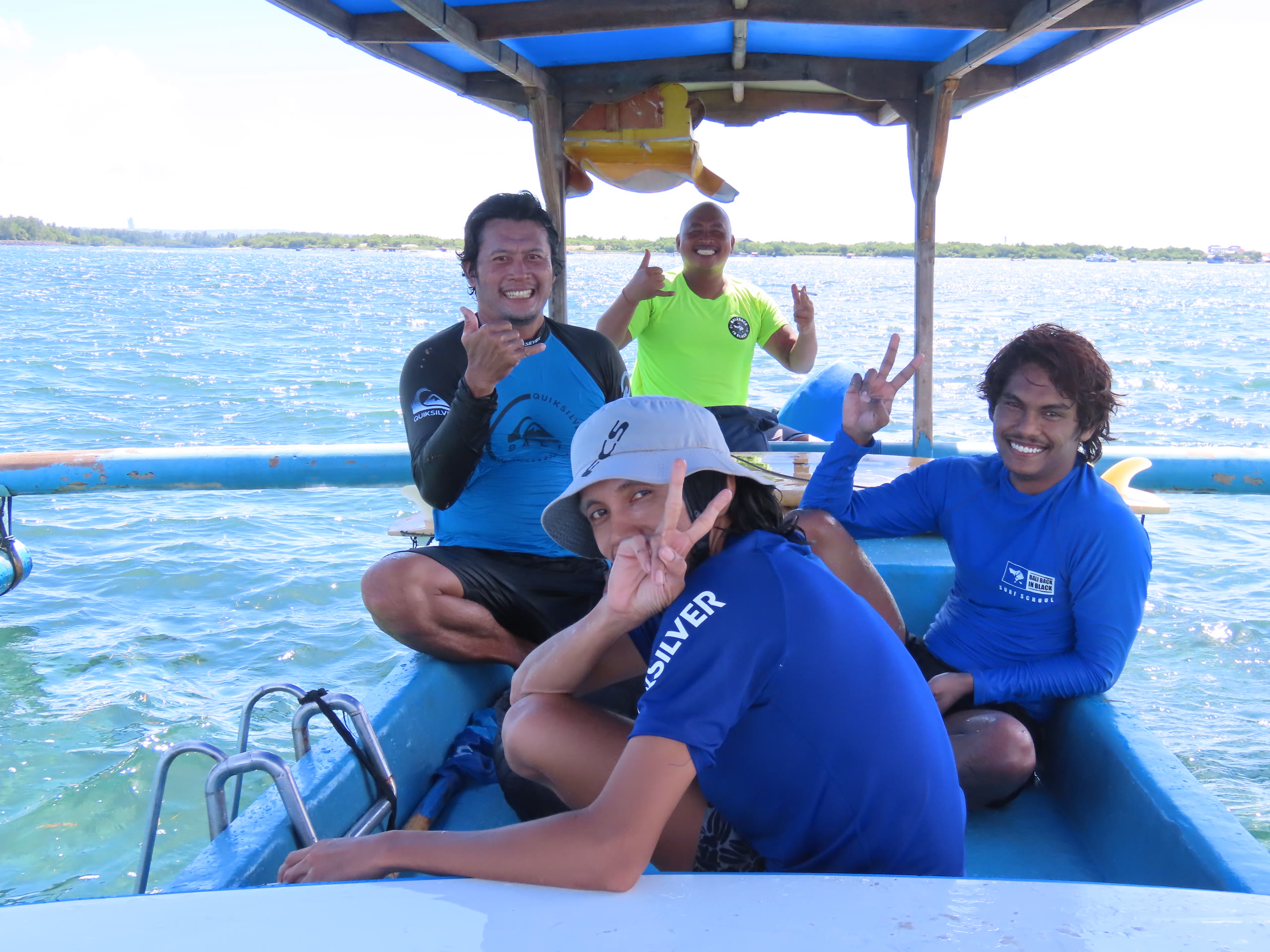 Bali Kami surf guides on their boat heading to Kuta Reef